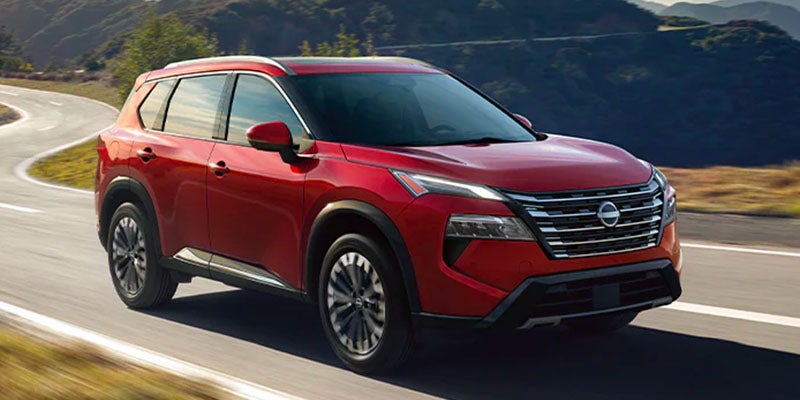 The 2025 Nissan Rogue driving with its engine power down the highway in Pompano Beach, FL